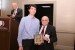 Dr. Nagib Callaos, General Chair, giving Dr. Kevin Foltz a plaque "In Appreciation for Delivering a Great Keynote Address at a Plenary Session."